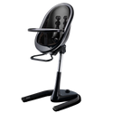 Black high chair with the tray fitted and the seat shell tilted back