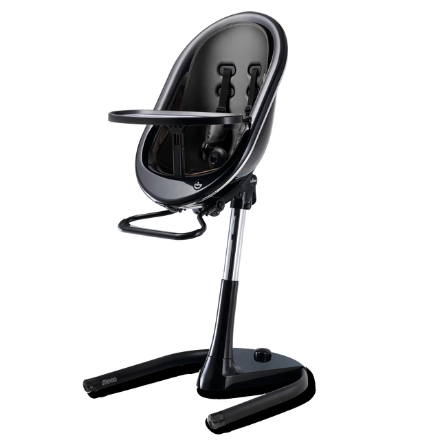 Black high chair with the tray fitted and the seat shell tilted back