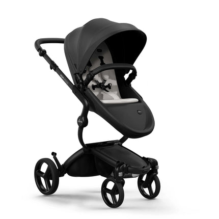 mima xari max Black stroller forward facing with a Stone White seat pad and the sun canopy pulled up