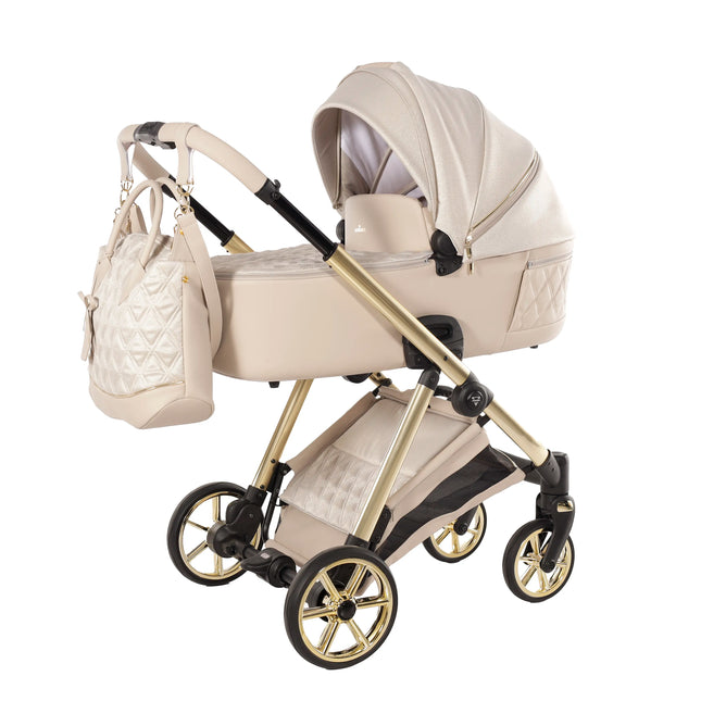 Junama Ellegante Lame Beige stroller travel system in a studio product photo