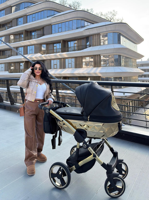 Hand-finished Junama Diamond stroller in black and gold