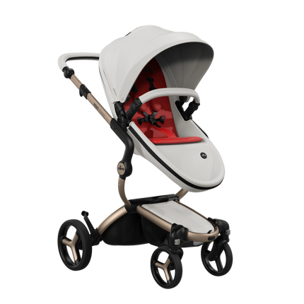 mima xari max White stroller facing the world with the Ruby Red seat pad and Champagne chassis