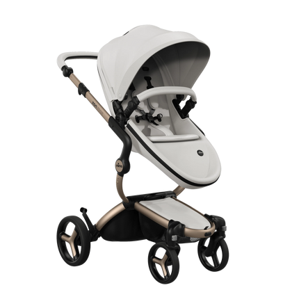 mima xari max White stroller with Champagne chassis, world facing with the Stone White seat pad