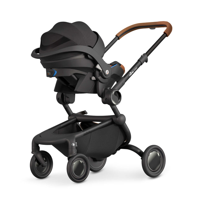 Compatible infant car seat clicked onto a Mima Creo using the Creo adapter set