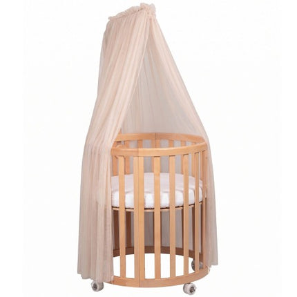 Beige Espiro Oasis canopy on the light wood frame, shown with the Oasis crib