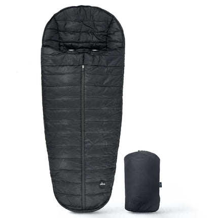 mima Compact Fold Footmuff in Black laid flat beside its packed carry bundle