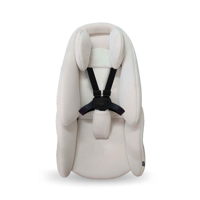 mima creo newborn snuggle insert seen from the front with the harness threaded through