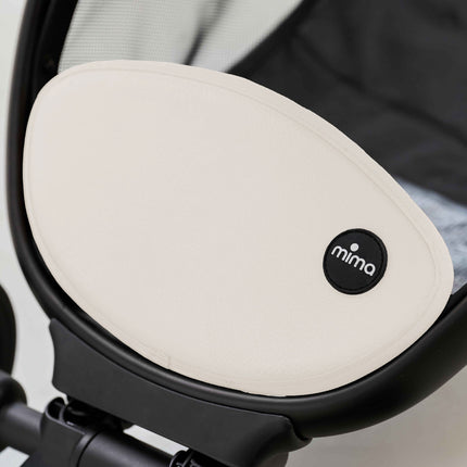 Close-up of the cream oval basket cover panel on the mima miro White travel stroller