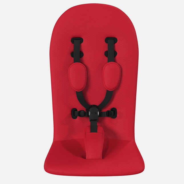 mima xari max Ruby Red replacement seat pad laid flat with its black 5-point harness threaded through